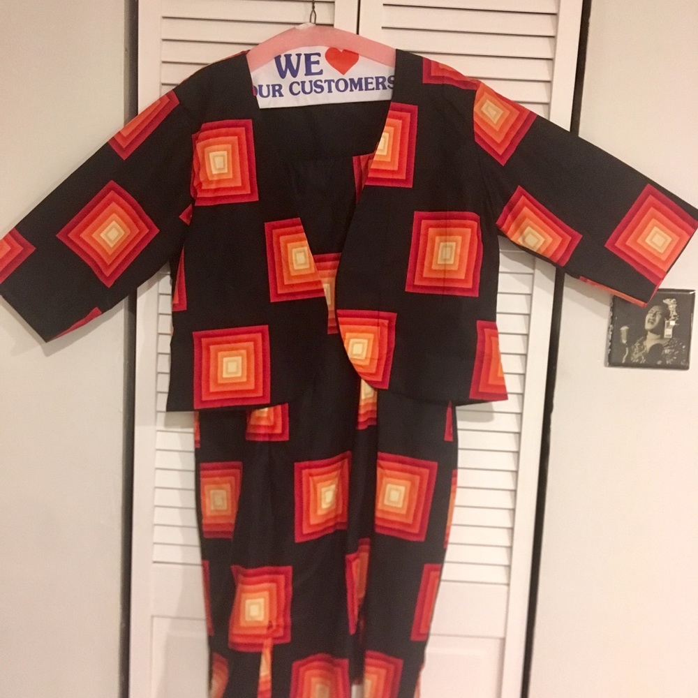 Tailor-made one of a kind dress with short jacket